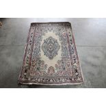 An approx. 4'10" x 3'4" blue and red pattern rug