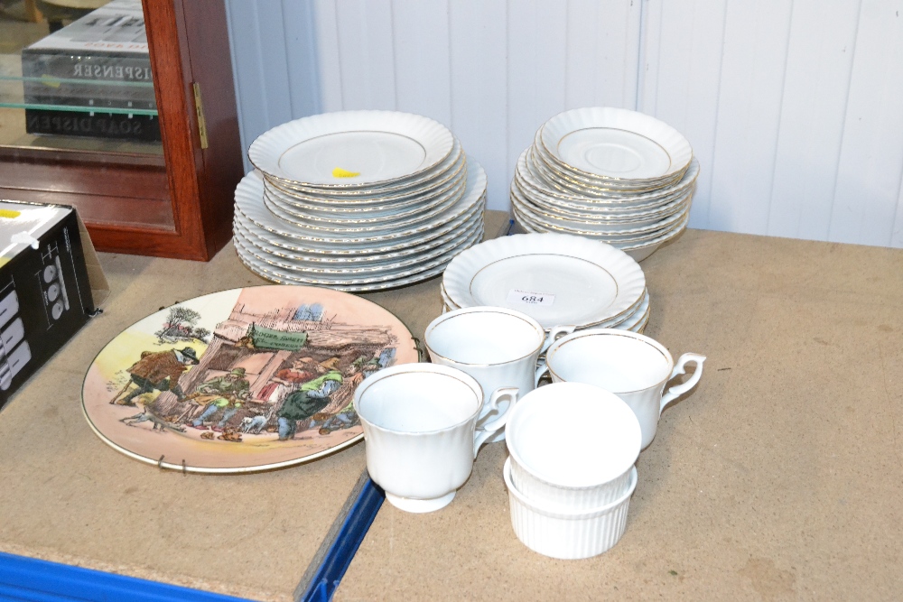 A collection of white and gilt decorated dinner an