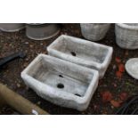 A pair of garden plant troughs with cherub decorat