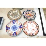 A Royal Crown Derby plate, an Imari plate, a pair