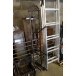 An ornate folding boot rack (129)