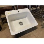 A cast iron and enamelled sink