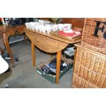 A Formica top drop leaf kitchen table