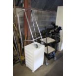 A two tier trolley; plastic storage cabinet and a
