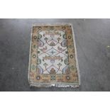 An approx. 3'2" x 2' pattern rug