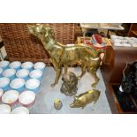 Four brass ornaments in the form of a dog, a cat,