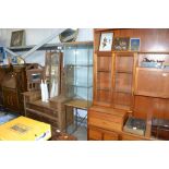 A glazed display cabinet raised on metal stand