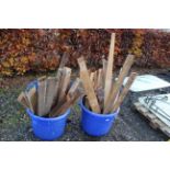 Two plastic tubs of offcut timber