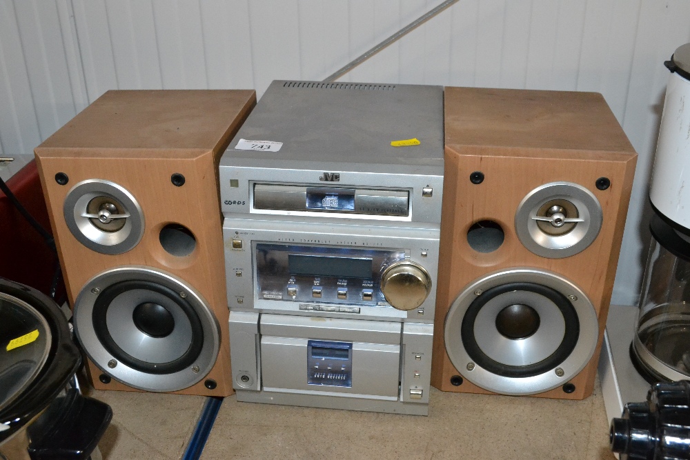 A JVC Hi-Fi with a pair of speakers