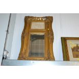 A gilt framed bevel wall mirror inset with parian