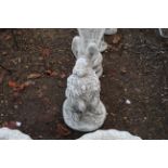A large alerted standing hare garden ornament