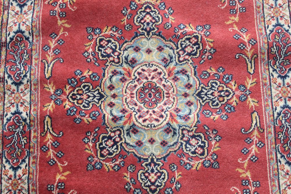 An approx. 6'3" x 7' red pattern rug - Image 3 of 3