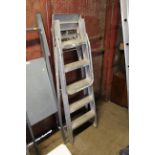 A set of folding metal decorators steps