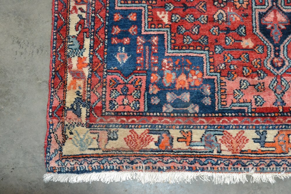 An approx. 7'1" x 4'3" Persian red and blue patter - Image 2 of 4