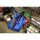 A bag of various rackets, dart board etc