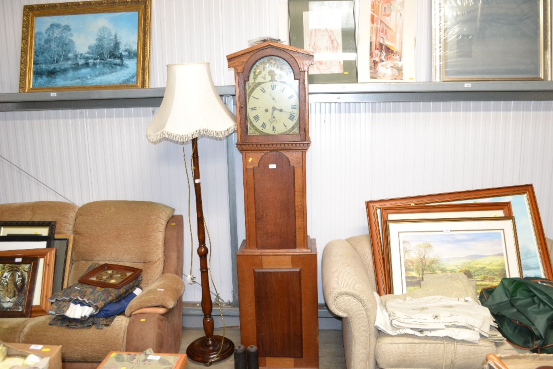 An oak long cased clock with painted dial