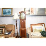 An oak long cased clock with painted dial