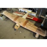 A part finished model wooden aircraft, wing span approx. 89 inches together with various other wings