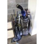 A golf bag and quantity of golf clubs with a folding golf trolley