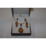 A Sterling silver and amber set necklace with simi