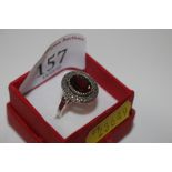 A vintage Sterling silver ring set with garnet and