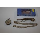 A Bosun's whistle with original box and a compass