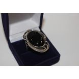 A large 925 dress ring set with black onyx