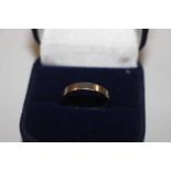 An 18ct white gold wedding band, approx. 3gms