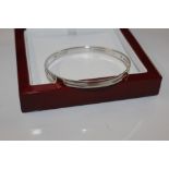 A Hot Diamonds Sterling silver bangle set with dia
