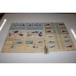 A collection of various cigarette cards, some cont