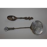 Two American white metal spoons