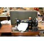 A Singer sewing machine in fitted case