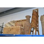 A wicker wine rack together with other wicker items