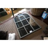 A small ornamental garden mirror (134)