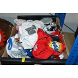 A box containing various Build-A-Bear clothes