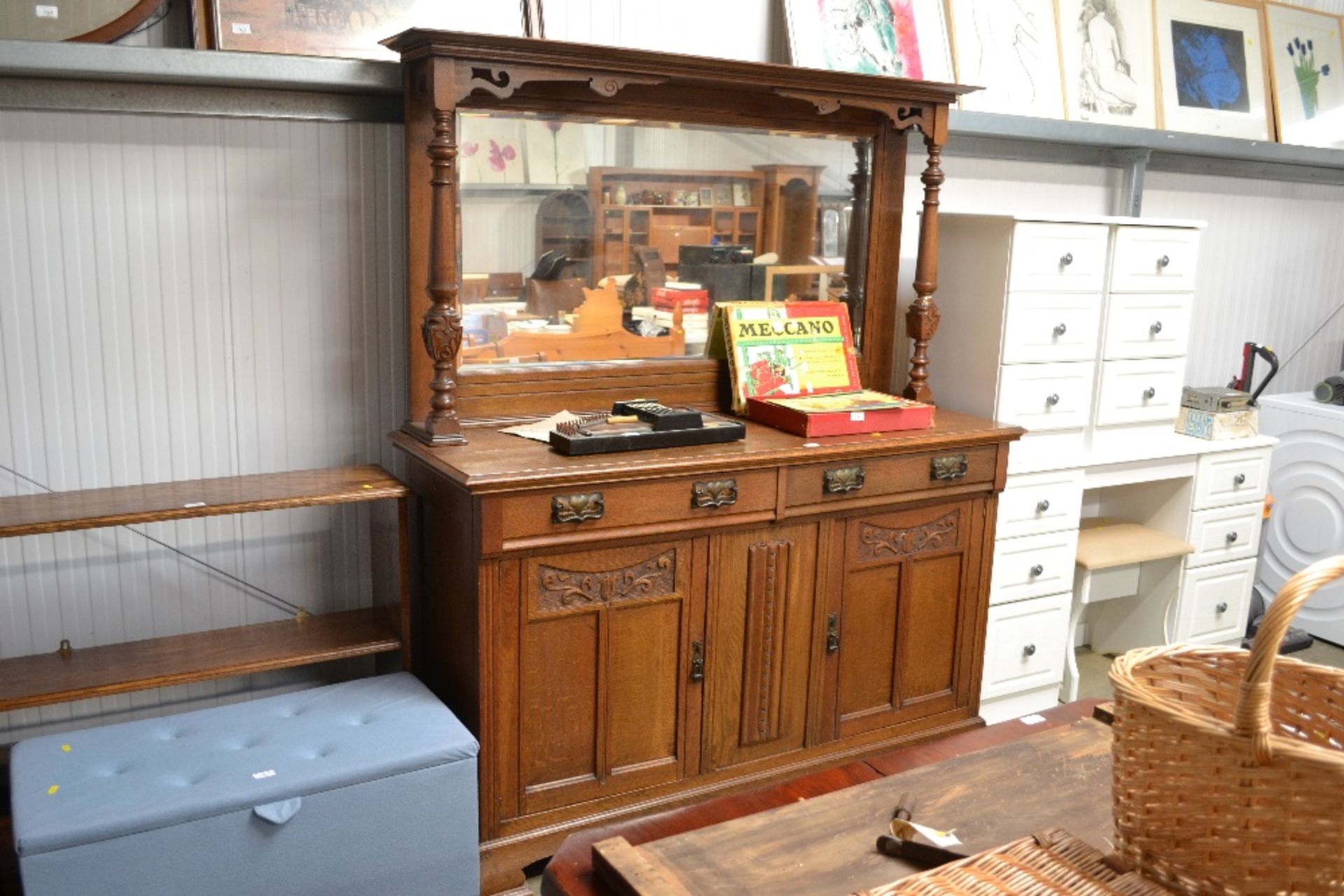 An oak Art Nouveau style mirrored back sideboard