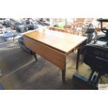 A pine drop leaf kitchen table