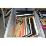 A box containing various LPs
