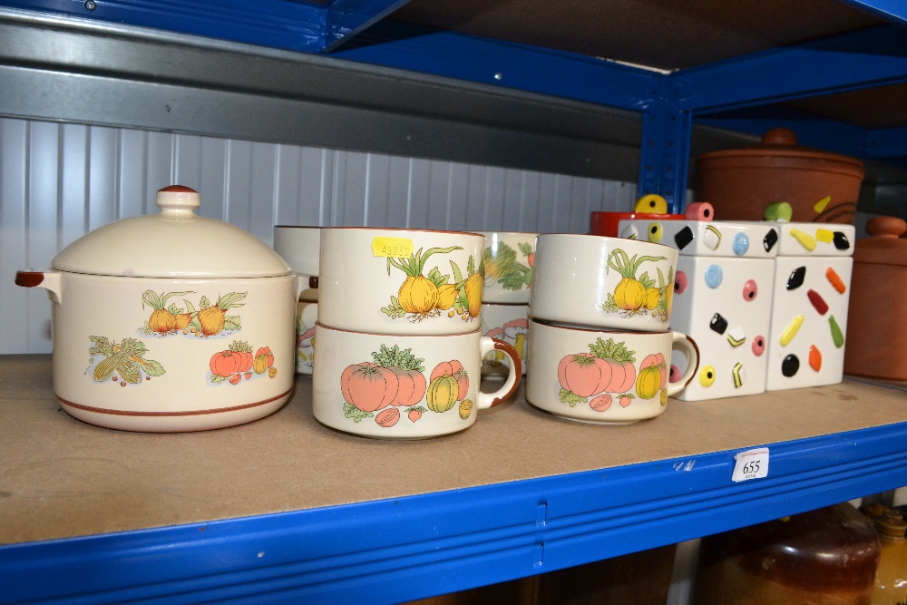 Three storage jars decorated with sweets; a collec