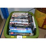 A box containing various DVDs