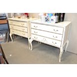 Two cream and gilt decorated three drawer chests