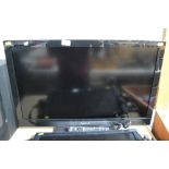 A Panasonic flat screen television with remote con