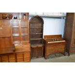 An oak bookcase fitted with a cupboard below