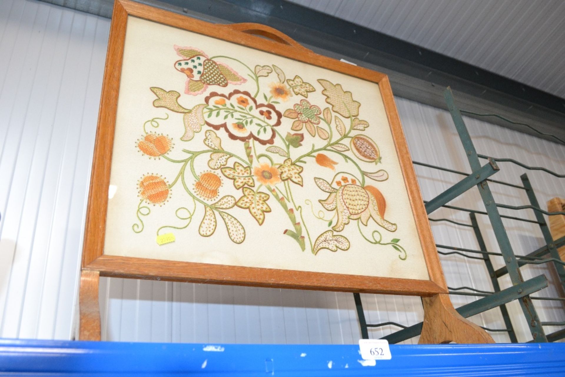 An embroidered fire screen