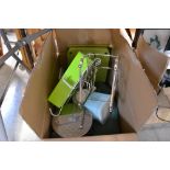 A box containing various kitchenalia