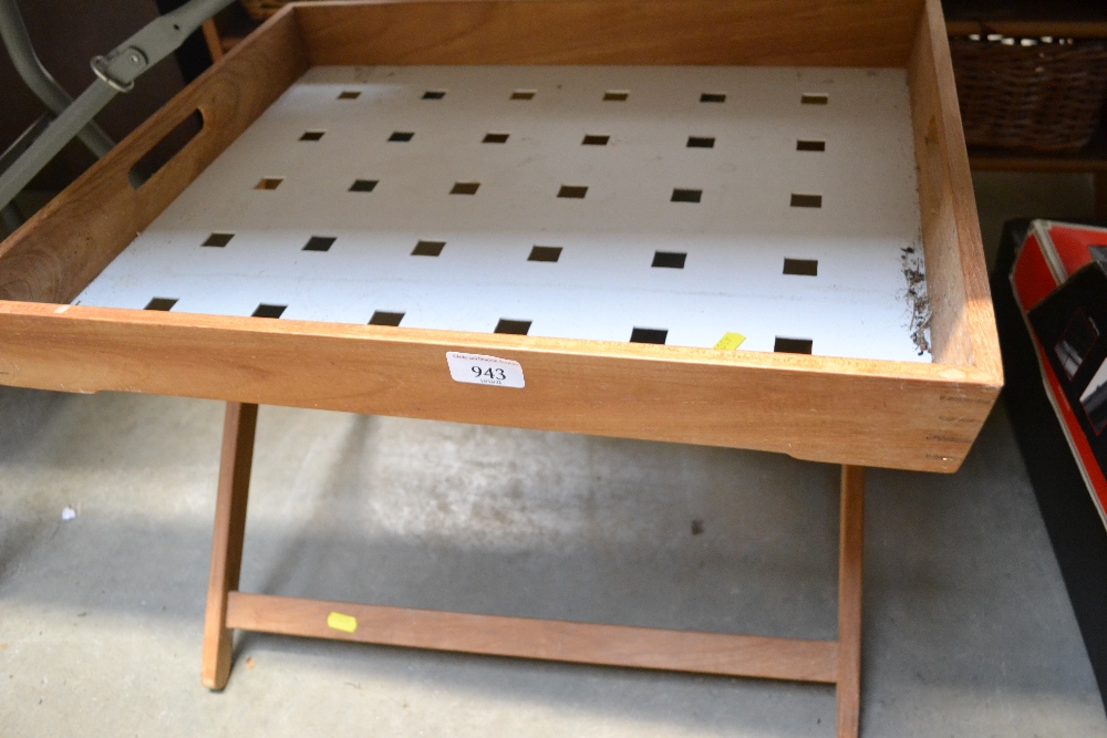 A tray on a folding stand