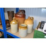 Three stoneware bottles and a jar