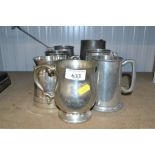 A quantity of pewter tankards