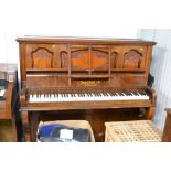 A mahogany cased upright piano