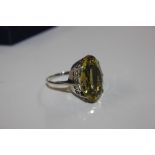 A large silver and citrine set ring